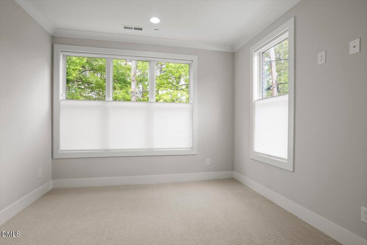 811 Maple Berry Lane, Unit 101 Raleigh, NC 27607 - Photo 30 of 45 an empty room with a window