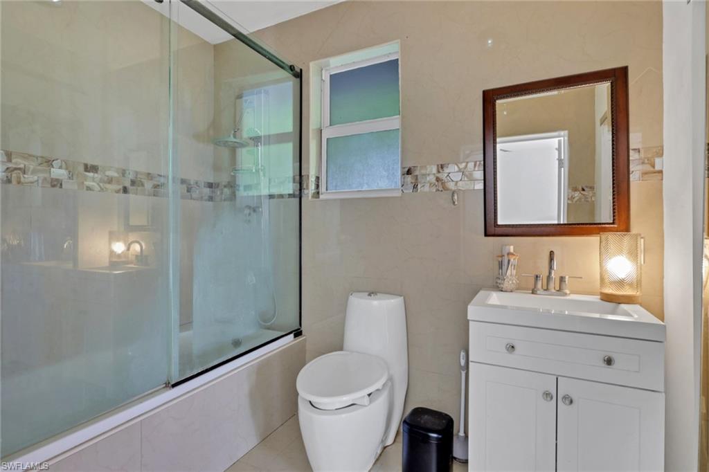 3341 2nd Avenue Southeast Naples, FL 34117 - Photo 20 of 43 a bathroom with a toilet sink and shower