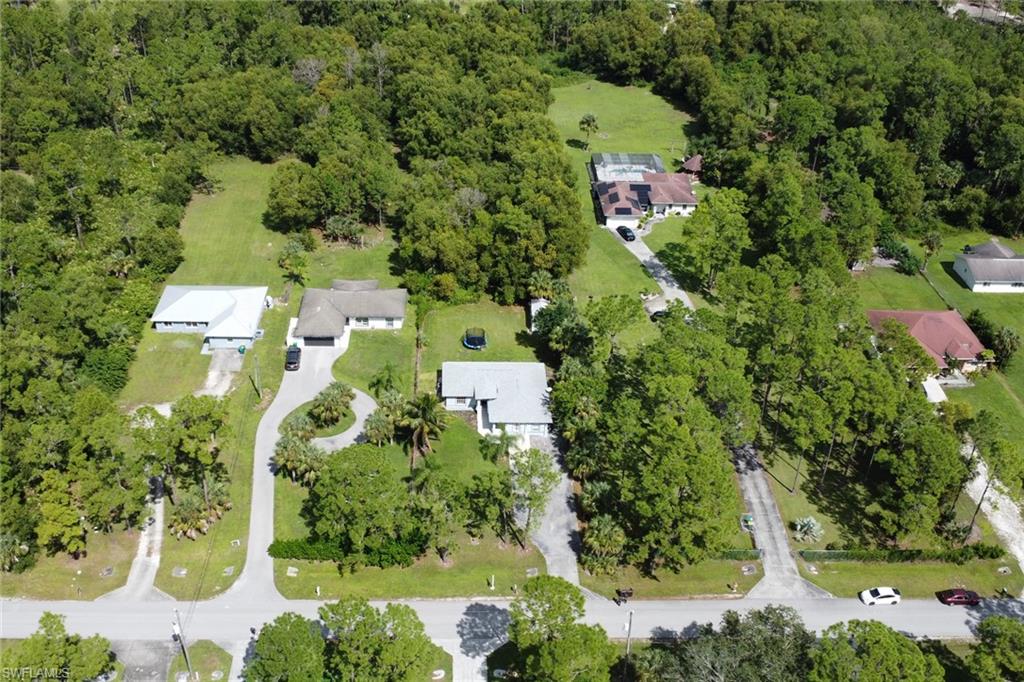 3341 2nd Avenue Southeast Naples, FL 34117 - Photo 33 of 43 an aerial view of residential house with outdoor space and trees all around