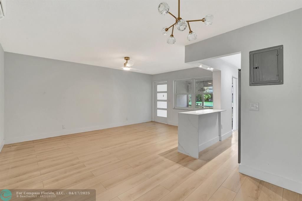 161 Northeast 10th Avenue, Unit 14A Hallandale Beach, FL 33009 - Photo 12 of 45 a view of a kitchen with a sink and cabinet area