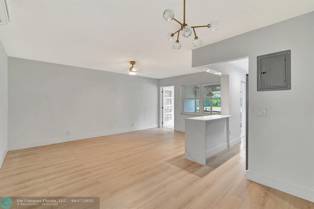 161 Northeast 10th Avenue, Unit 14A Hallandale Beach, FL 33009 - Photo 14 of 45 a view of an empty room with a window