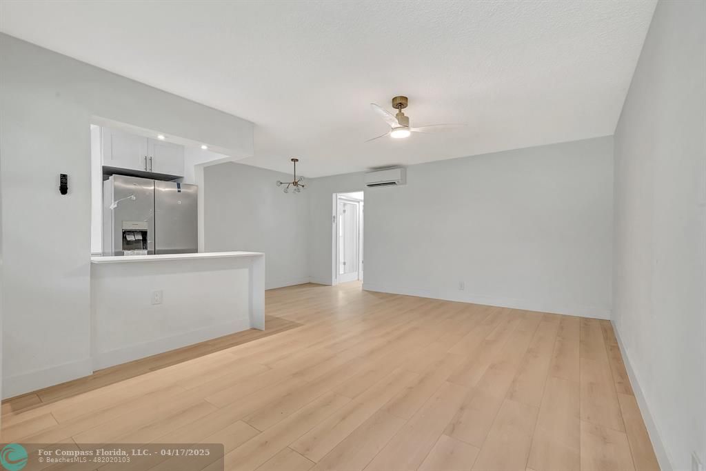 161 Northeast 10th Avenue, Unit 14A Hallandale Beach, FL 33009 - Photo 16 of 45 a view of an empty room with kitchen