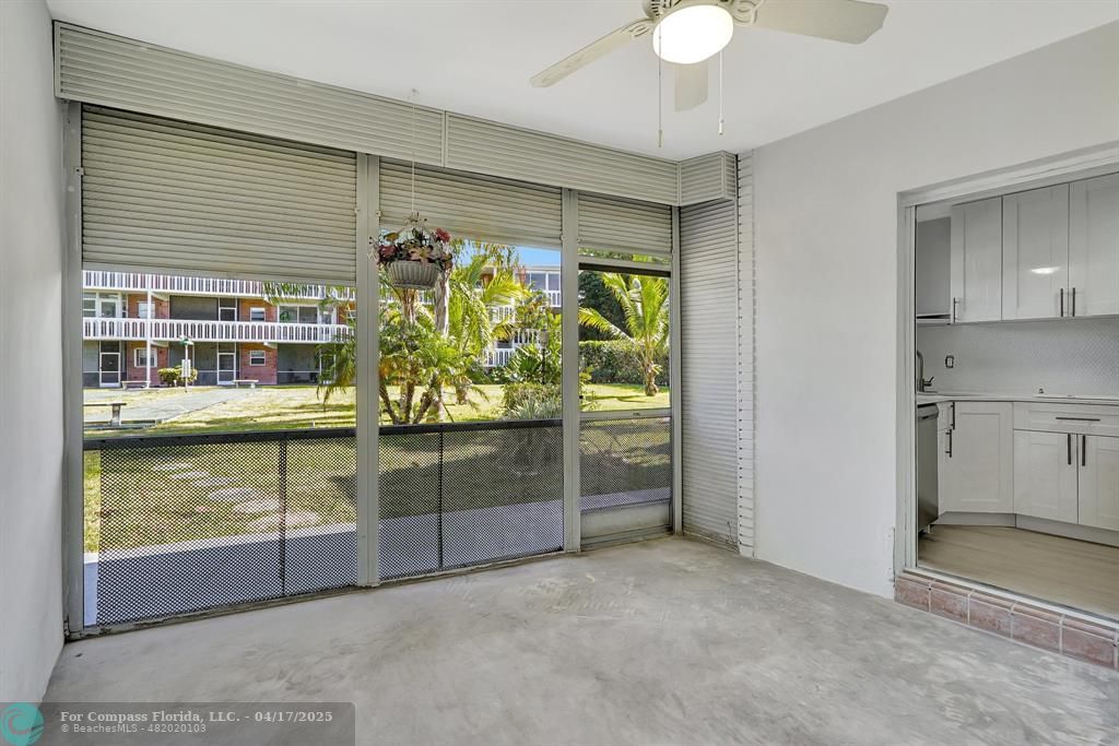 161 Northeast 10th Avenue, Unit 14A Hallandale Beach, FL 33009 - Photo 22 of 45 a kitchen with stainless steel appliances granite countertop a stove and a window