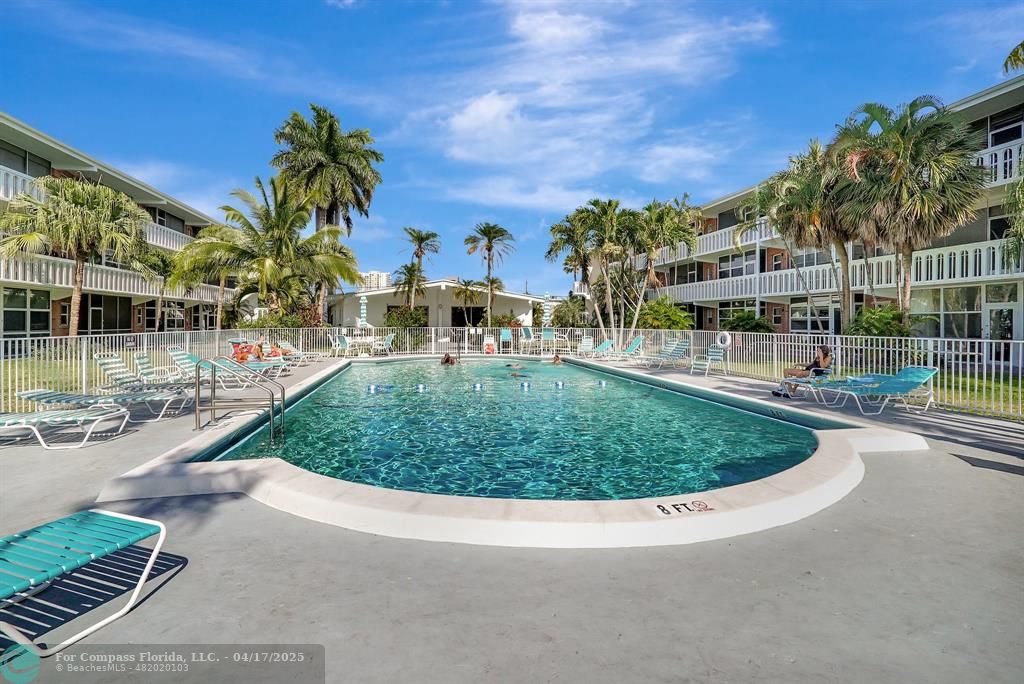 161 Northeast 10th Avenue, Unit 14A Hallandale Beach, FL 33009 - Photo 30 of 45 a view of a swimming pool with a patio