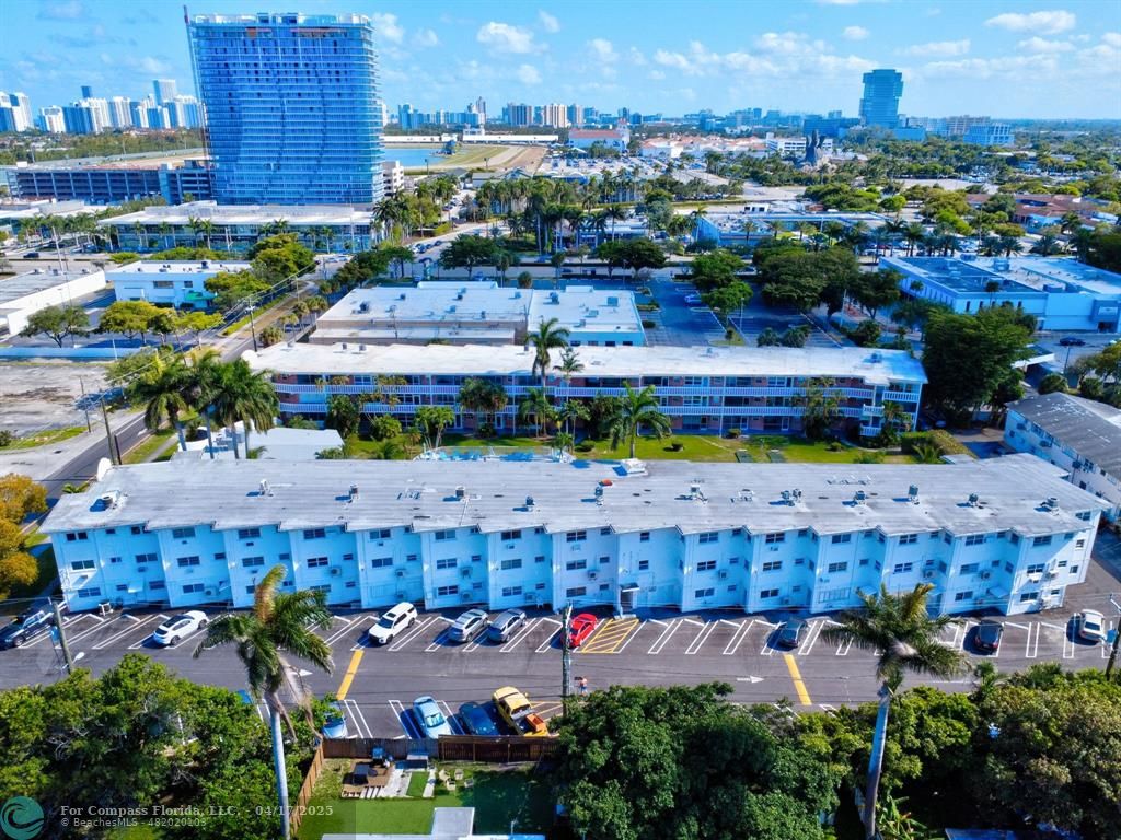 161 Northeast 10th Avenue, Unit 14A Hallandale Beach, FL 33009 - Photo 31 of 45 an aerial view of a houses with yard