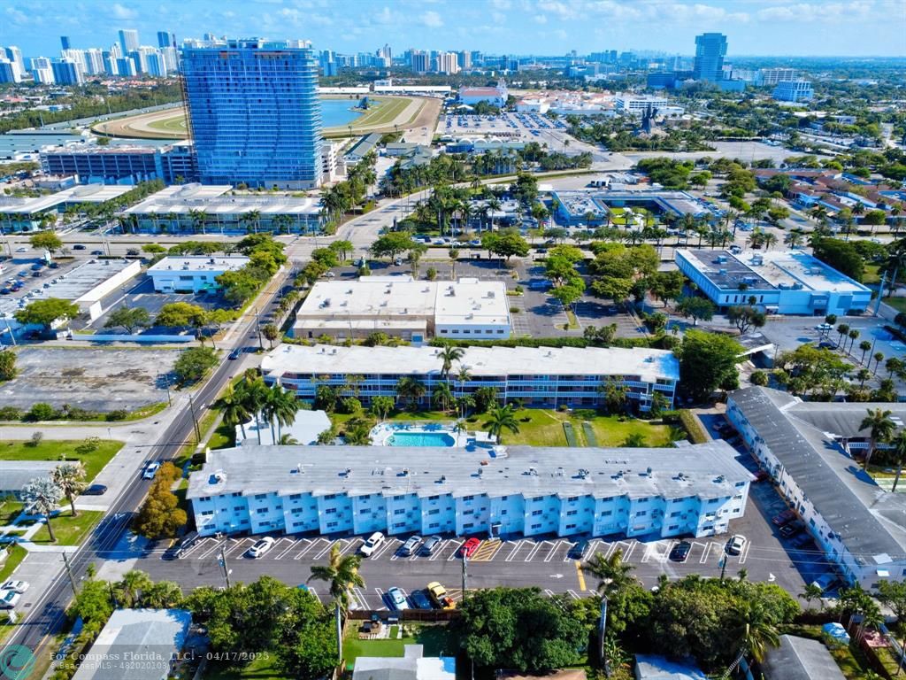 161 Northeast 10th Avenue, Unit 14A Hallandale Beach, FL 33009 - Photo 32 of 45 an aerial view of a yard with outdoor space