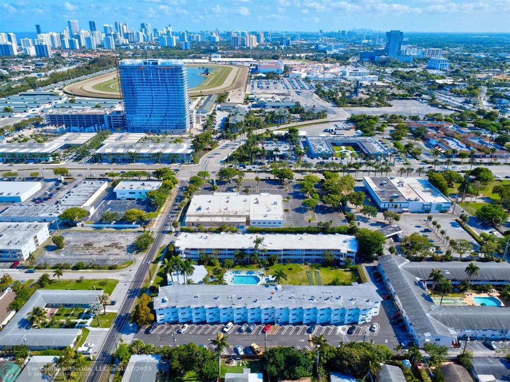 161 Northeast 10th Avenue, Unit 14A Hallandale Beach, FL 33009 - Photo 33 of 45 an aerial view of residential houses with outdoor space and swimming pool