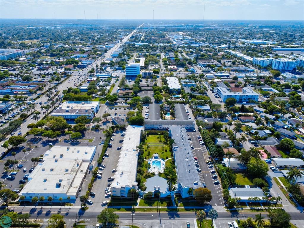 161 Northeast 10th Avenue, Unit 14A Hallandale Beach, FL 33009 - Photo 35 of 45 an aerial view of residential building and lake
