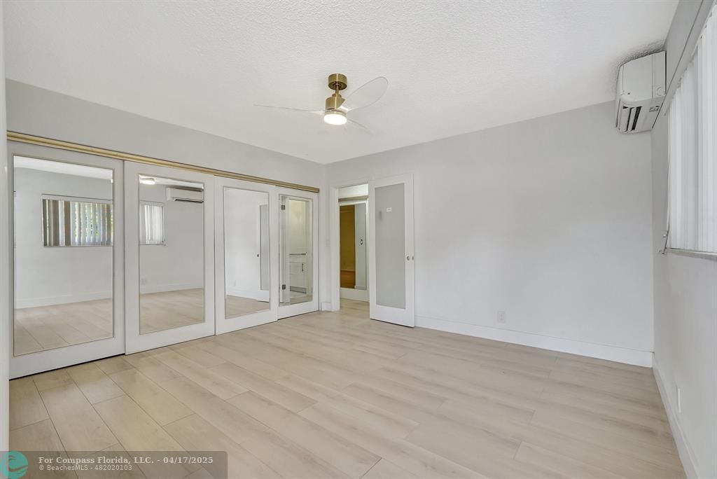 161 Northeast 10th Avenue, Unit 14A Hallandale Beach, FL 33009 - Photo 4 of 45 a view of an empty room with a window