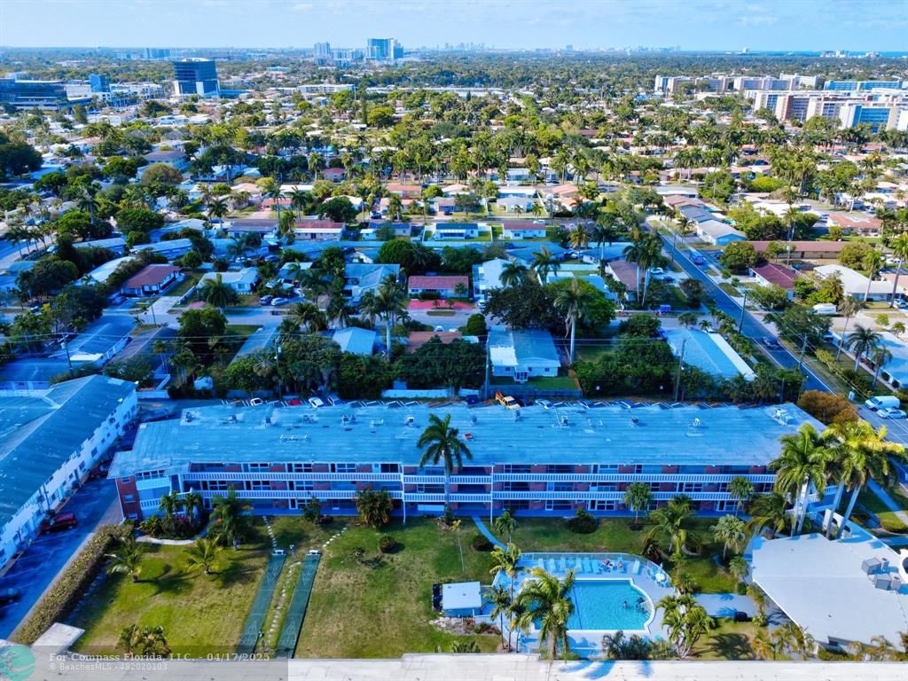 161 Northeast 10th Avenue, Unit 14A Hallandale Beach, FL 33009 - Photo 42 of 45 an aerial view of a house with a yard