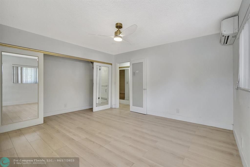 161 Northeast 10th Avenue, Unit 14A Hallandale Beach, FL 33009 - Photo 9 of 45 a view of an empty room with a window