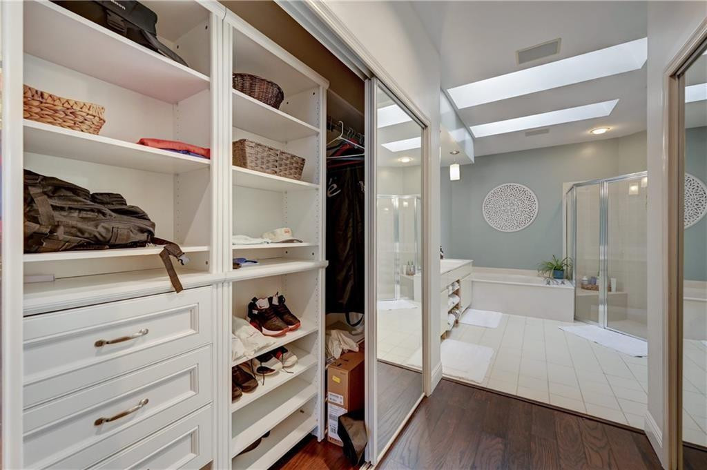 8171 Hampton Wood Drive Boca Raton, FL 33433 - Photo 20 of 56 a view of walk in closet with clothes and shoes