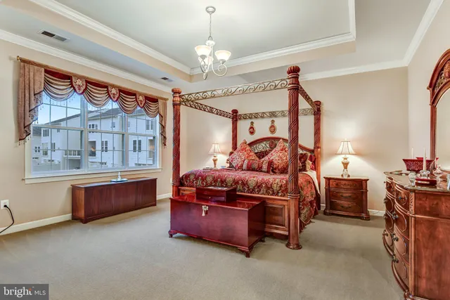 a bedroom with bed and window