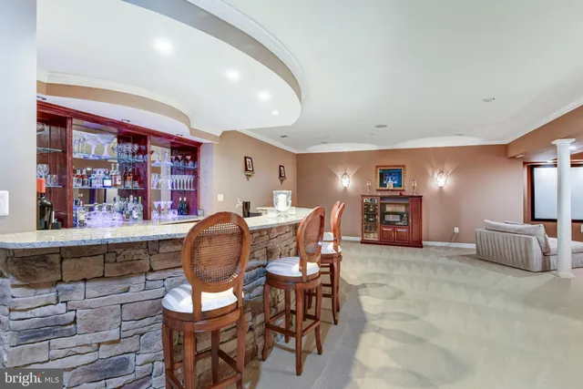 a dining room with furniture and chandelier