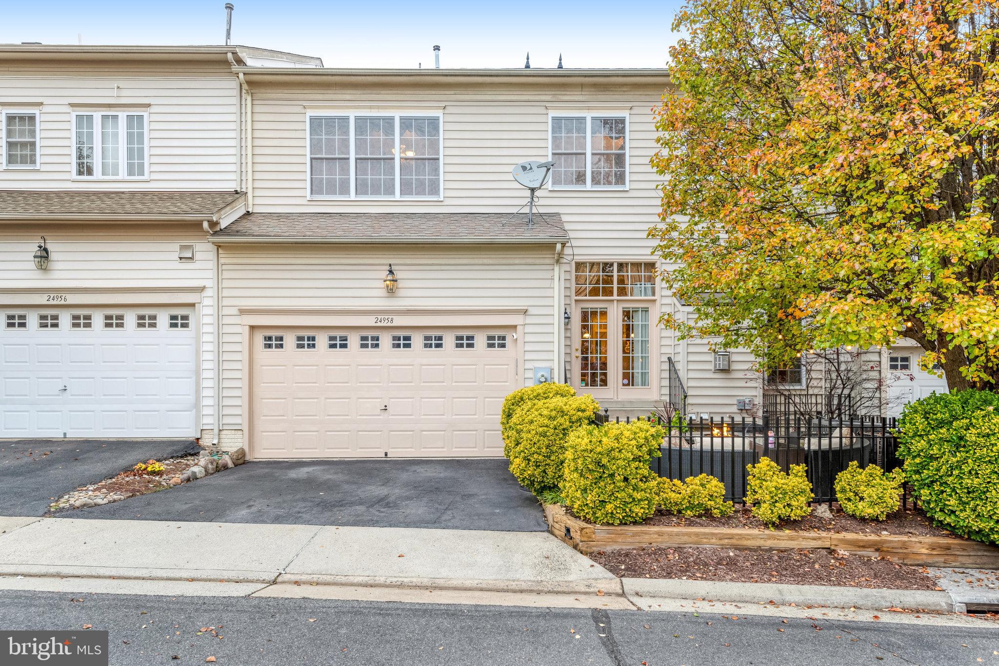 24958 Brookbark Terrace Chantilly, VA 20152 - Photo 24 of 26 a front view of a house with a garden