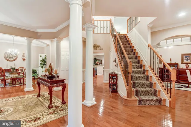a view of a living room and entryway