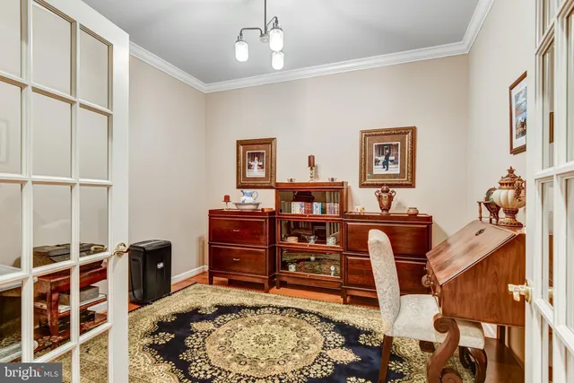 a bed room with a bed dresser and a chair