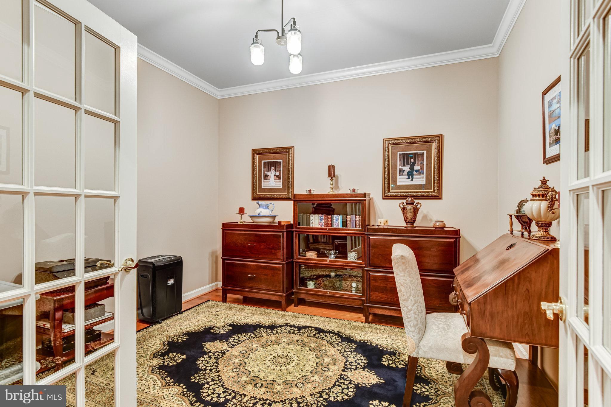 24958 Brookbark Terrace Chantilly, VA 20152 - Photo 9 of 26 a bed room with a bed dresser and a chair