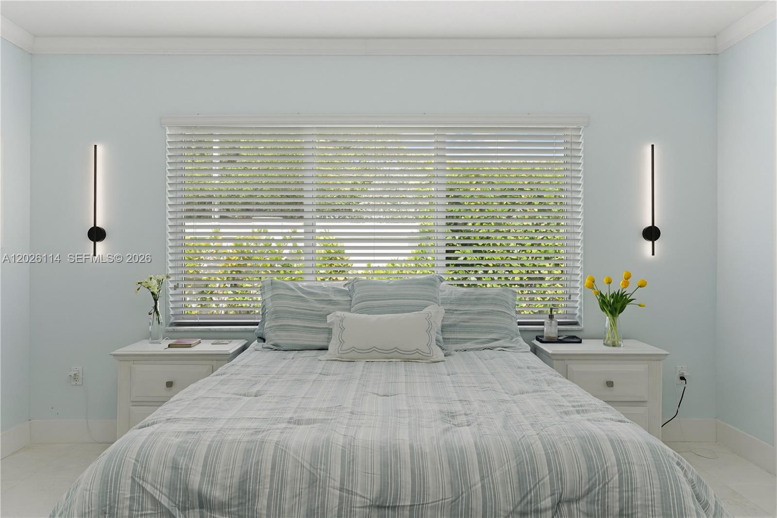 9641 Southwest 66th Street Miami, FL 33173 - Photo 28 of 57 a bedroom with a bed and a window