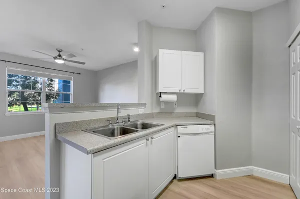a kitchen with a sink and cabinets