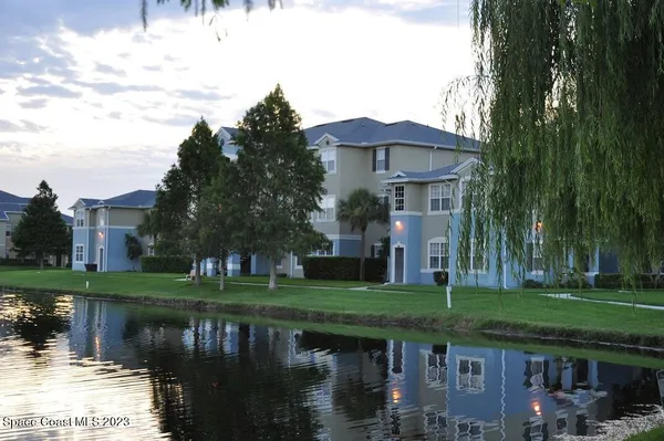 a front view of a house with a lake view