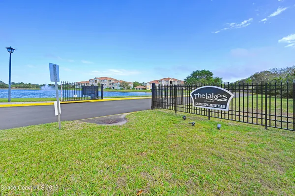 a aerial view of a house with swimming pool and a yard