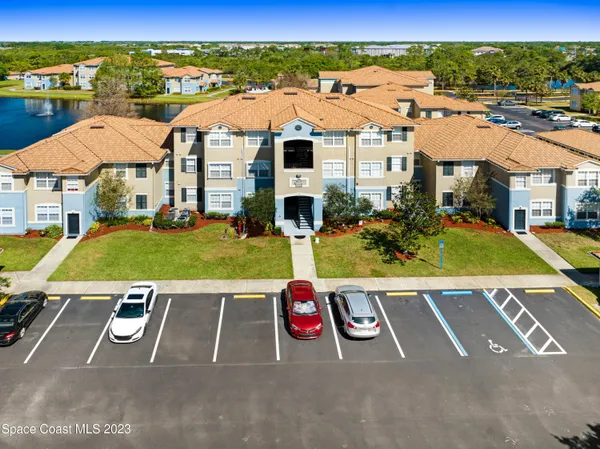 an aerial view of a house with a swimming pool
