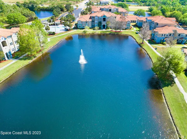 an aerial view of a house with a ocean view