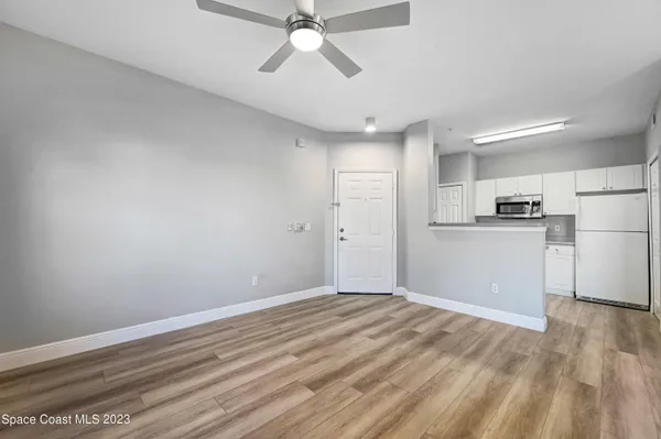 a view of a kitchen with a dishwasher and a refrigerator