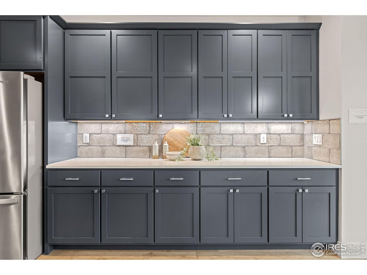 217 57th Avenue Greeley, CO 80634 - Photo 11 of 35 a kitchen with a sink cabinets and appliances