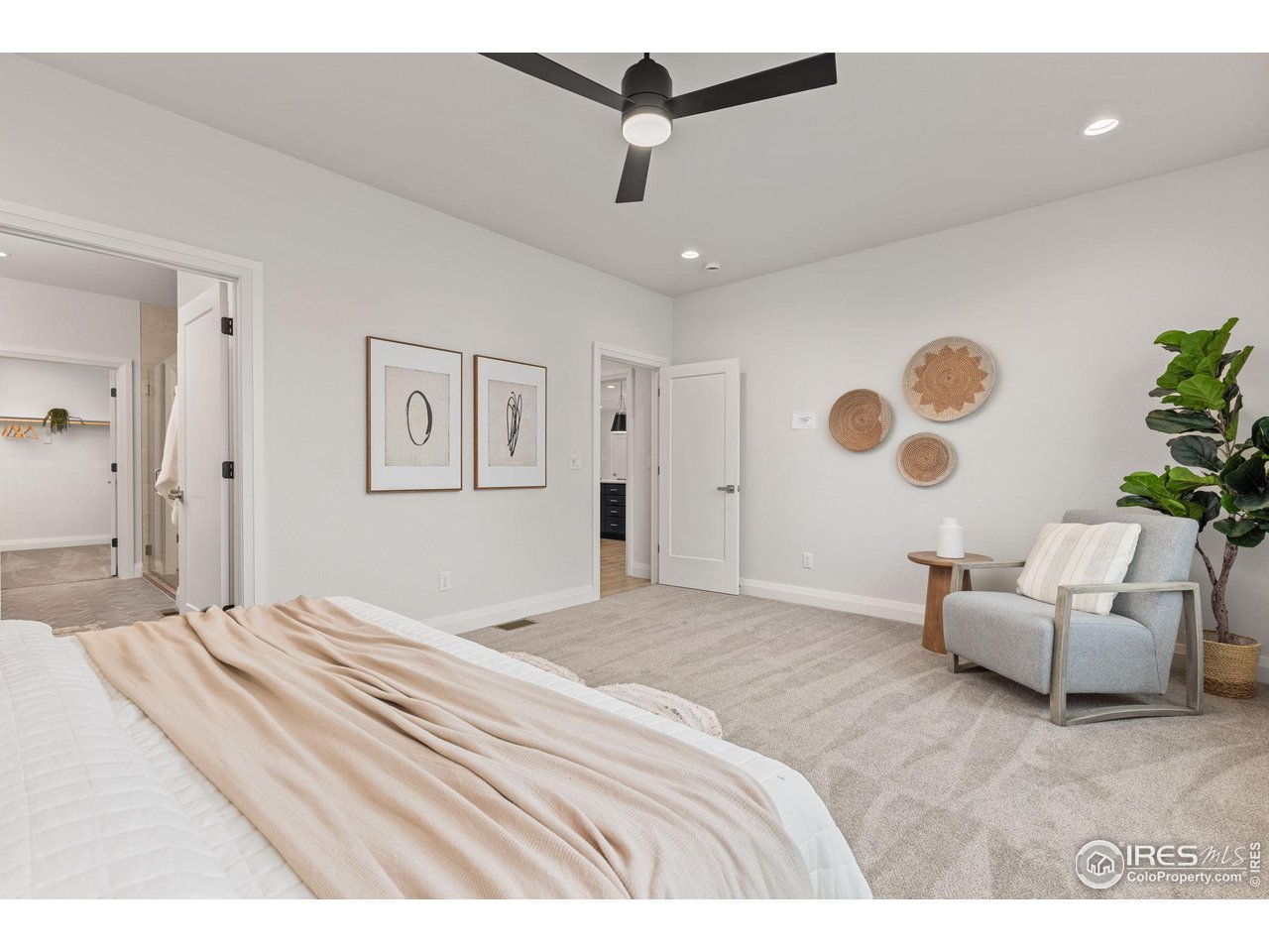 217 57th Avenue Greeley, CO 80634 - Photo 18 of 35 a bedroom with a bed couch and a ceiling fan