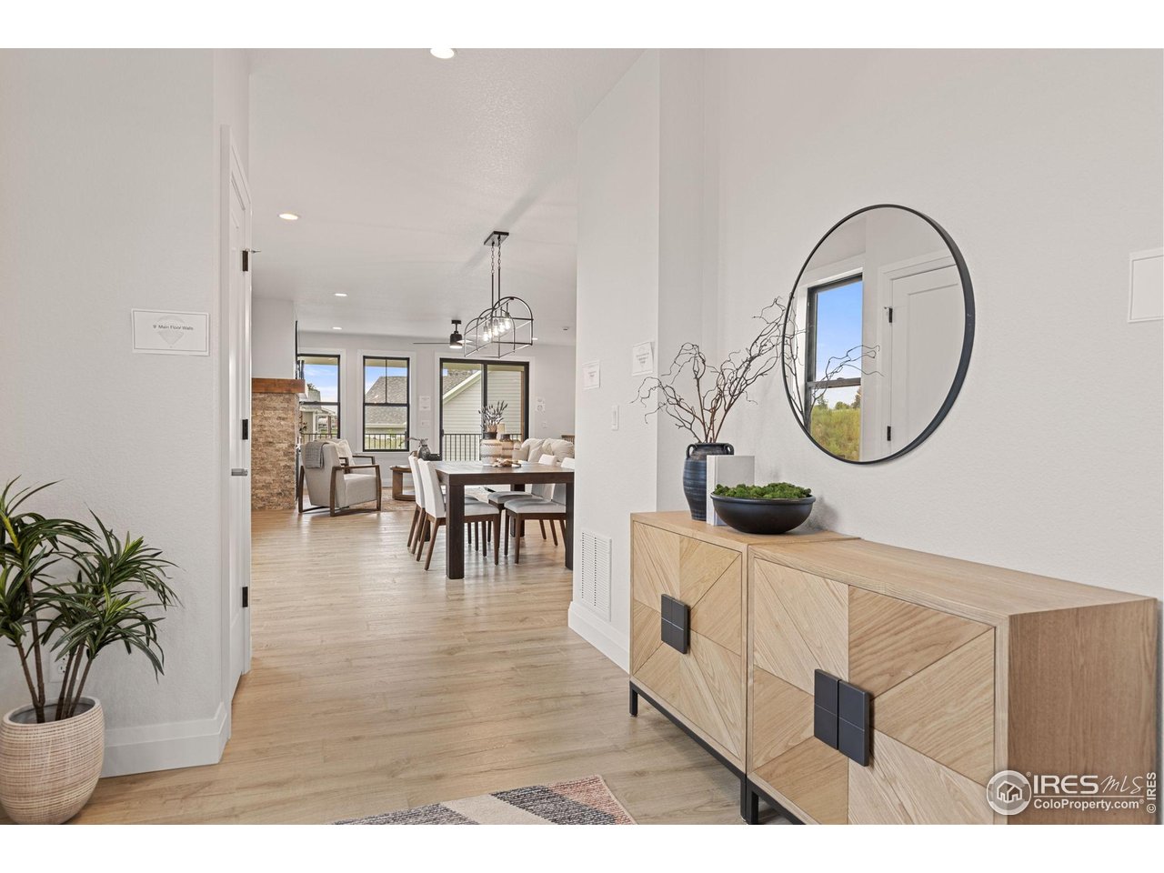 217 57th Avenue Greeley, CO 80634 - Photo 6 of 35 a living room with furniture and a mirror