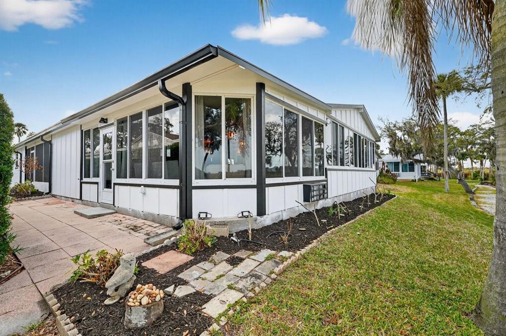 747 Navigators Way Edgewater, FL 32141 - Photo 15 of 73 a view of a house with a yard