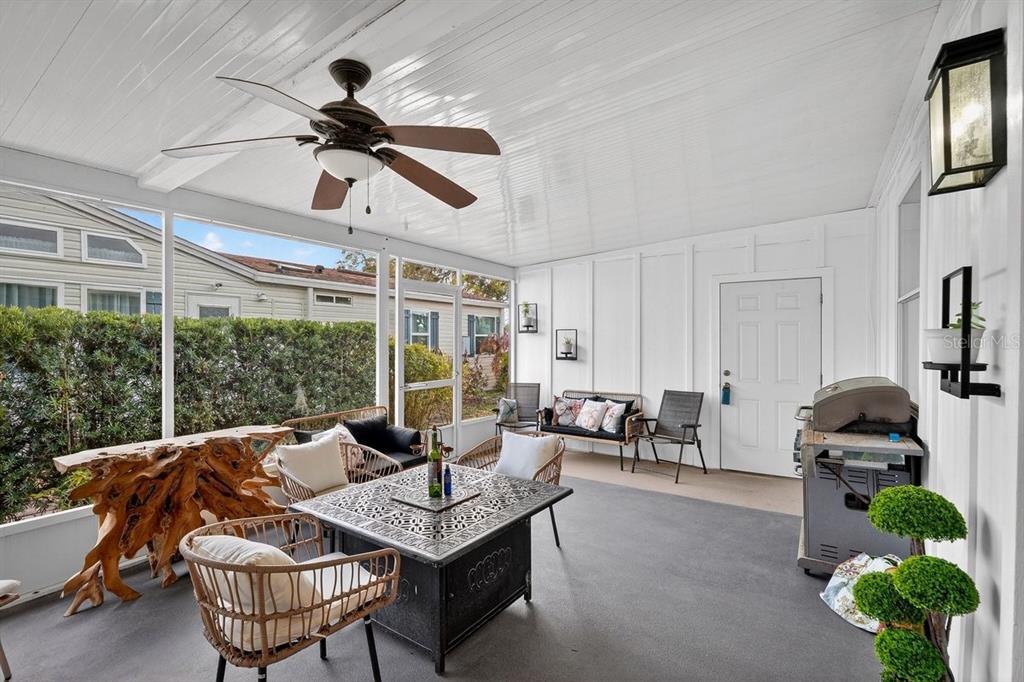 747 Navigators Way Edgewater, FL 32141 - Photo 19 of 73 a living room with furniture a ceiling fan and a window