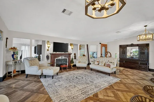 a view of a livingroom with dining room and furniture