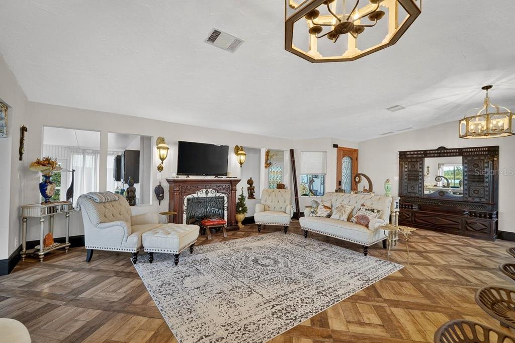 747 Navigators Way Edgewater, FL 32141 - Photo 25 of 73 a living room with furniture and a flat screen tv