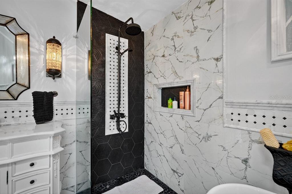 747 Navigators Way Edgewater, FL 32141 - Photo 46 of 73 a bathroom with a toilet sink and mirror