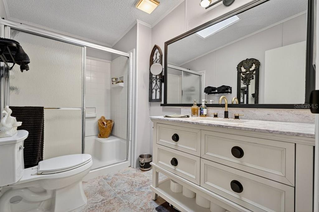 747 Navigators Way Edgewater, FL 32141 - Photo 51 of 73 a bathroom with a sink a toilet and shower
