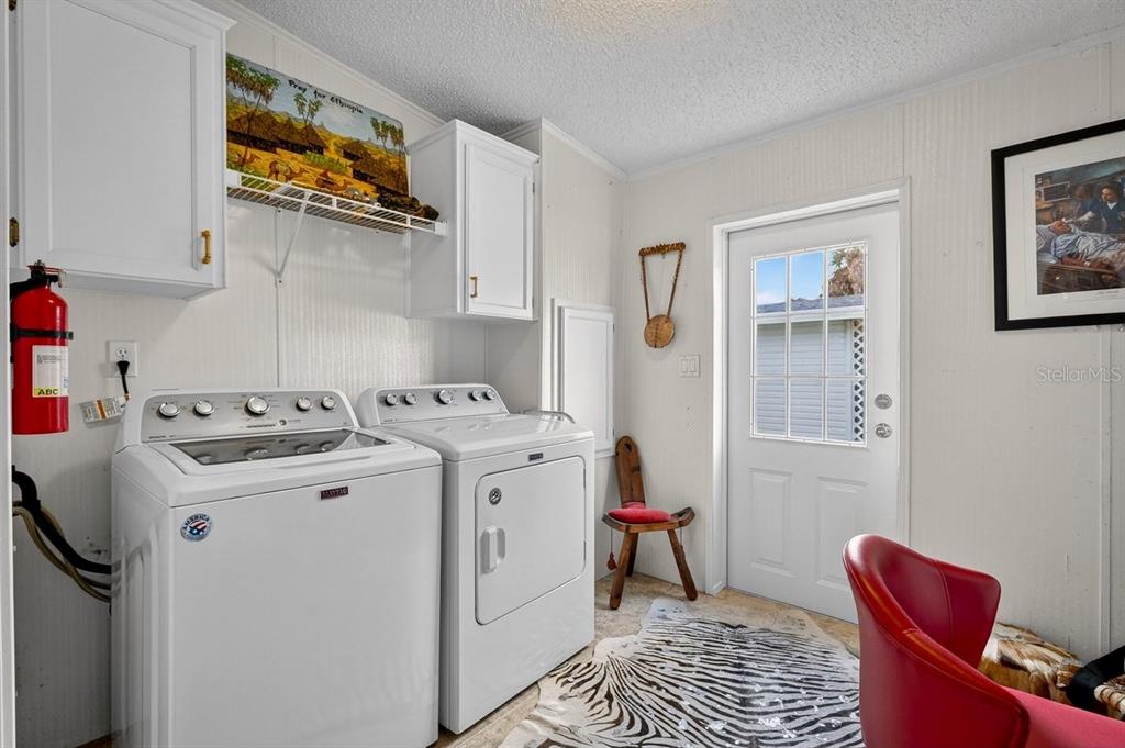 747 Navigators Way Edgewater, FL 32141 - Photo 53 of 73 a utility room with dryer and washer