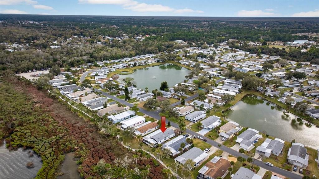 747 Navigators Way Edgewater, FL 32141 - Photo 7 of 73 an aerial view of residential houses with outdoor space