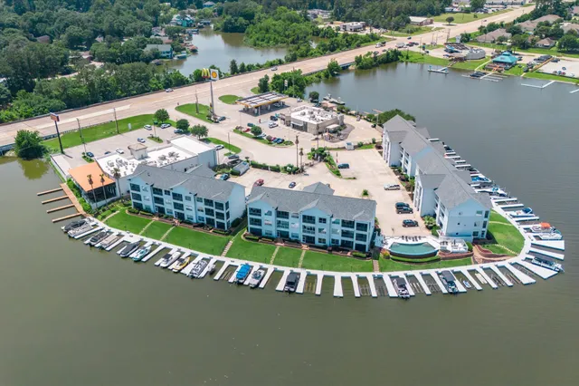 an aerial view of a house with a lake view