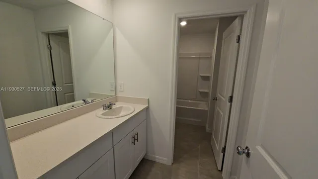 a white toilet sitting next to a bath tub