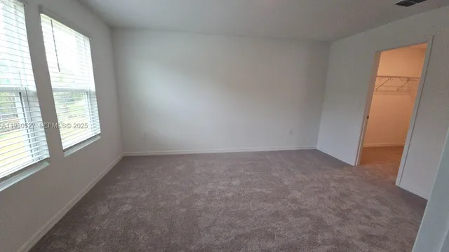 a view of hallway with washer and dryer
