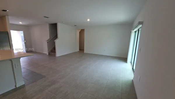 a view of an empty room with a window