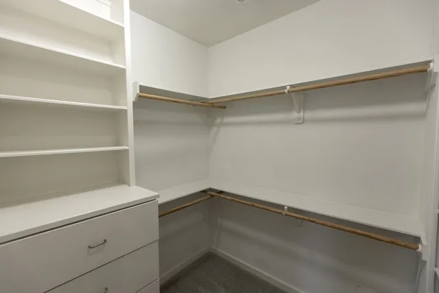 a view of an empty walk in closet