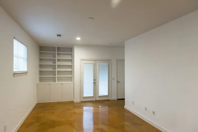 an empty room with a empty space and window