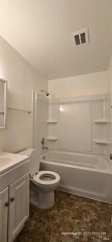 a bathroom with a toilet a sink and a bathtub