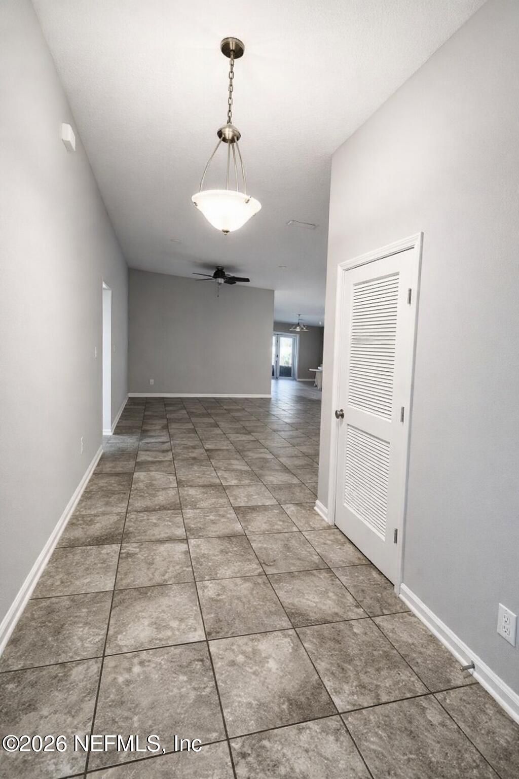 5937 Round Table Road Jacksonville, FL 32254 - Photo 2 of 10 a view of a hallway with a chandelier