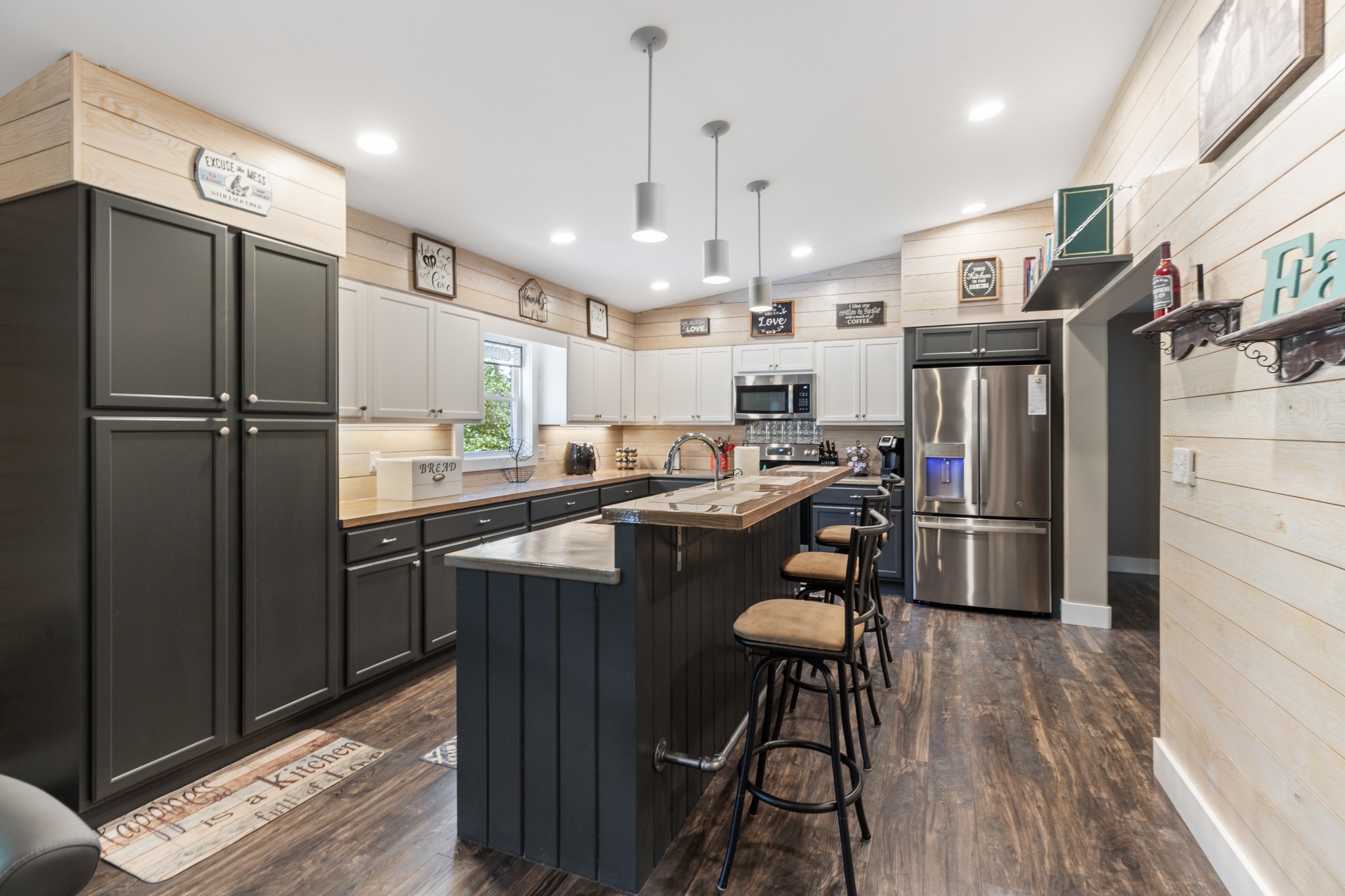 724 Plunders Creek Road Dickson, TN 37055 - Photo 8 of 29 a kitchen with stainless steel appliances granite countertop a refrigerator a sink dishwasher a stove and a refrigerator with wooden floor