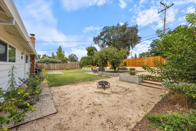 a backyard of a house with lots of green space